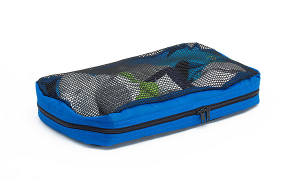 A full, closed Small Tri-Star Packing Cube in Island (blue) 120 Aether.